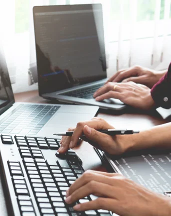 People at computers providing support