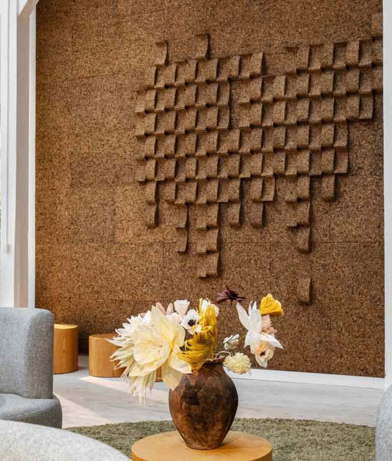 7N office with a brown wall and a green carpet in the Copenhagen office in Denmark. 