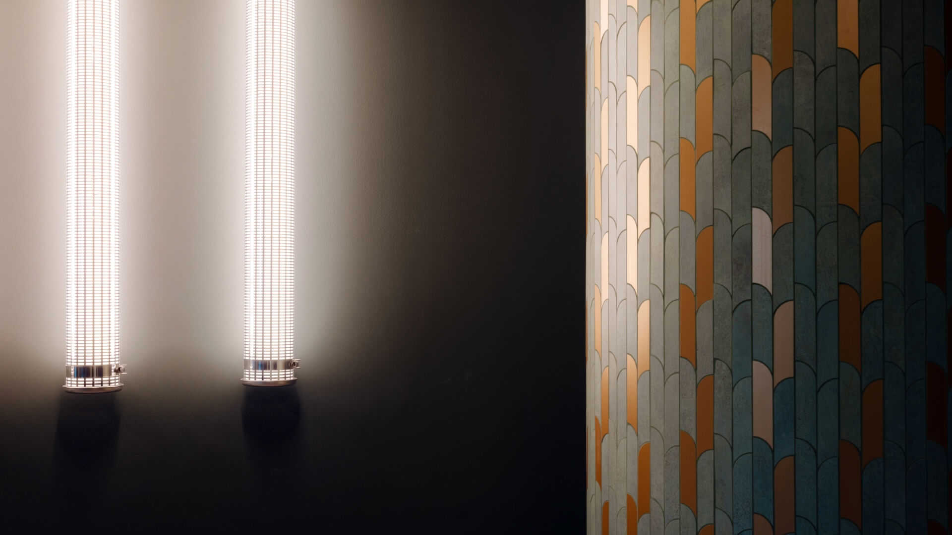 Lamps and mosaic on wall in the Warsaw office in Poland. 