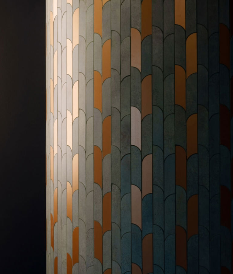Lamps and mosaic on wall in the Warsaw office in Poland. 
