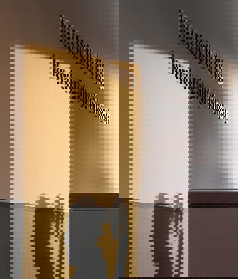 The reception of the 7N Warsaw office in Poland, with a woman in the background.