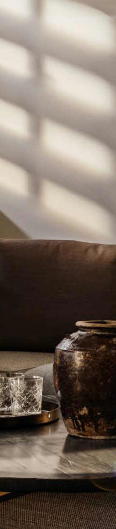 Grey sofas in a meeting room in 7N's Aarhus office in Denmark. 