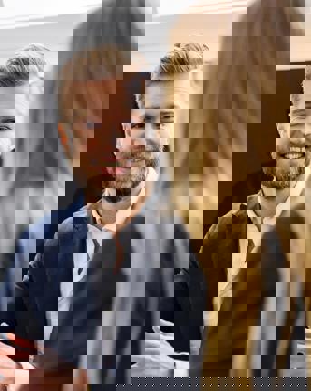 Man smiling at woman during a meeting in the 7N's Copenhagen office 