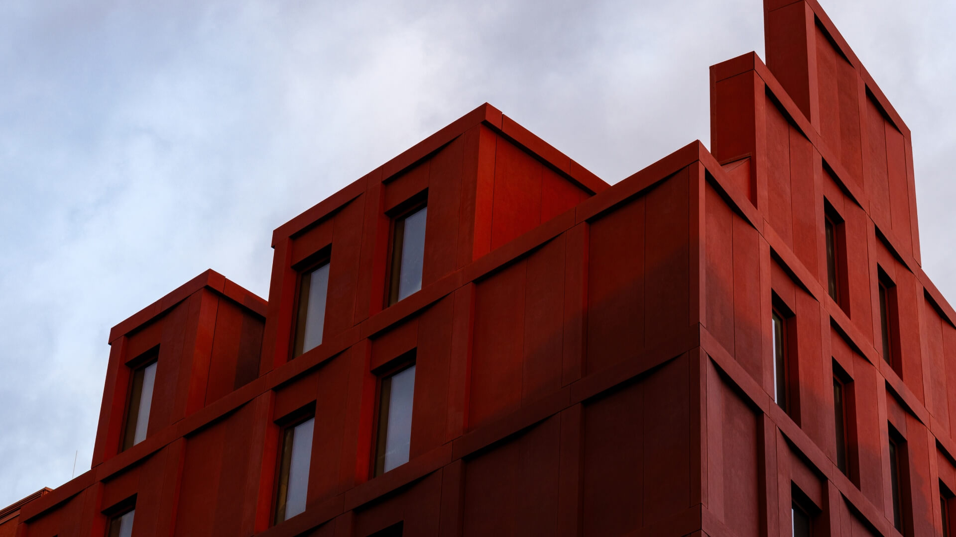 Gdansk office in Poland that is a red building. 