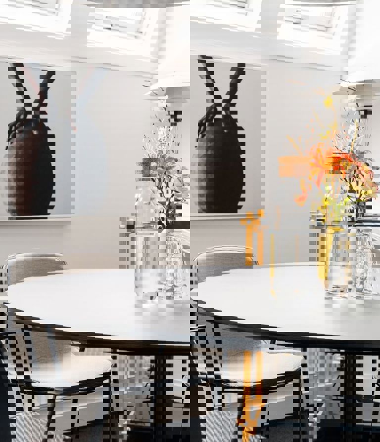 Meeting room with flowers and a bottle of water on the table