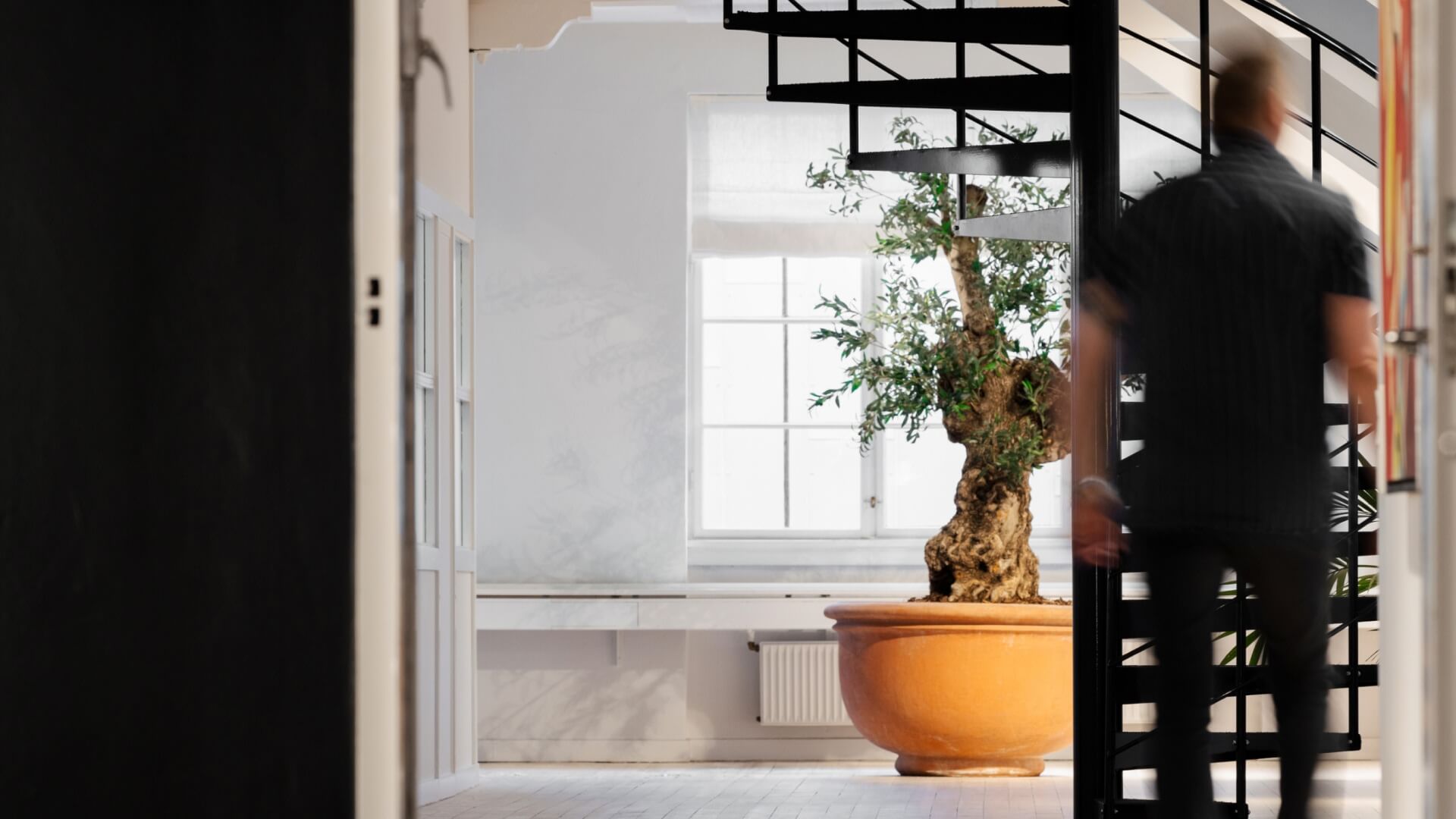 Man walking towards staircase in the Copenhagen office in Denmark. 