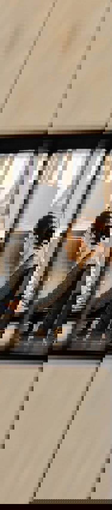 Woman working at office seen through squares