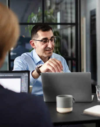 People sitting around table in the Copenhagen office during a meeting