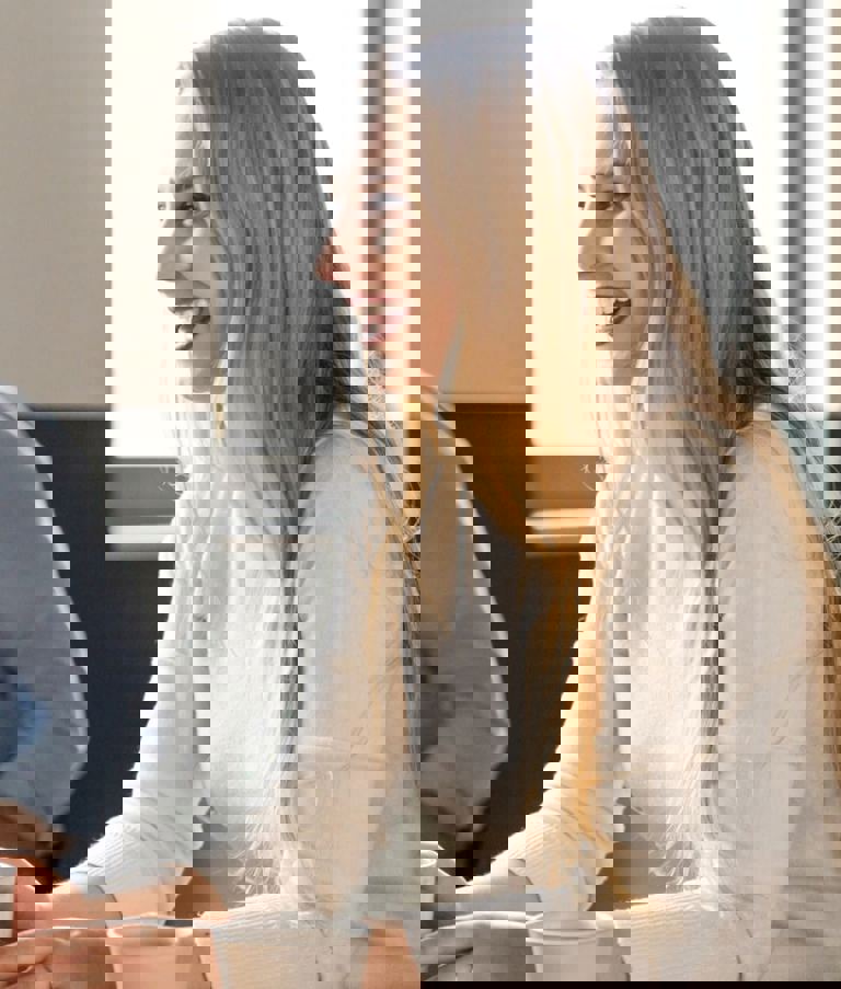 Man and woman at table laughing